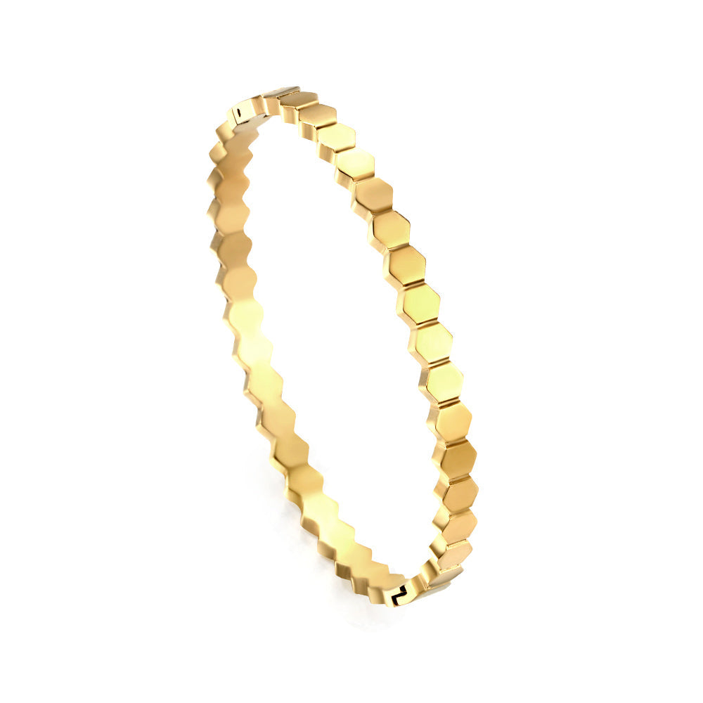 Hard bracelet with diamonds strung together with small gold-colored discs asonjewelry